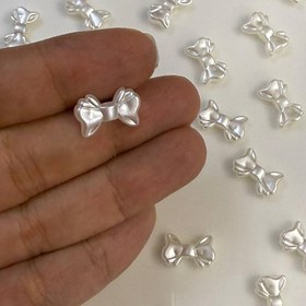 تصویر مهره پاپیون صدفی 