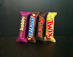 تصویر بالش و کوسن فانتزی طرح شکلات کوچک 