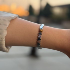 تصویر دستبند حدید و چشم ببر 