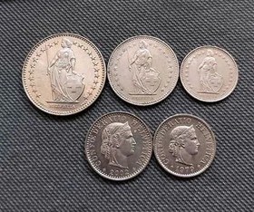 تصویر سکه ارزشمند 12, 1, 2 فرانک سوئیس و 10 و 20 سنت 
