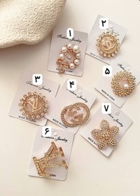 تصویر سنجاق سینه طلایی 