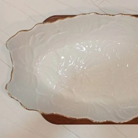 تصویر مرغ خوری گل برجسته لب طلا 