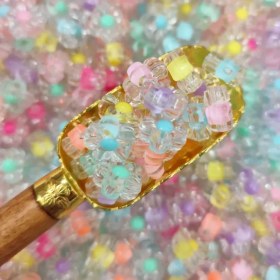 تصویر مهره رنگی گل شفاف (100گرمی) 