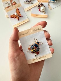 تصویر سنجاق سینه ۷ 