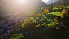 تصویر دانلود فوتیج نمای هوایی دهکده آلپ Aerial View Of An Alpine Village 