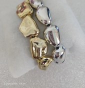 تصویر دستبند طلایی دفرمه 