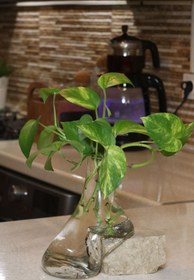 تصویر گلدون دفرمه زیر سنگی 