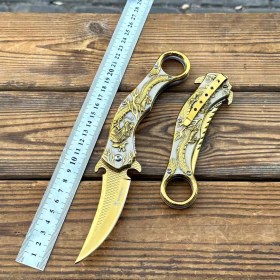 تصویر چاقو تاشو کارامبیت طلایی طرح اژدها 