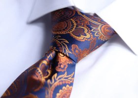 تصویر کراوات سرمه ای ترمه نارنجی آتیشی طرح دار Duk Romano 