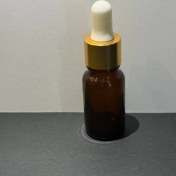 تصویر شیشه قهوه‌ای 10 میل همراه با قطره چکان سفید طلایی 