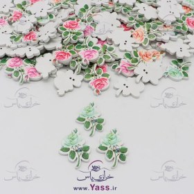 تصویر دکمه چوبی طرح گل سبز آبی 
