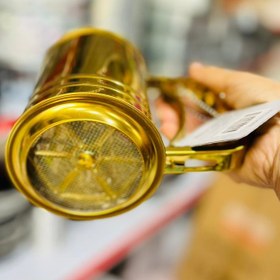 تصویر الک چرخشی طلایی استیل 