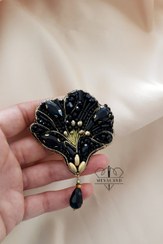 تصویر گلسینه جواهردوزی گل مشکی طلایی 