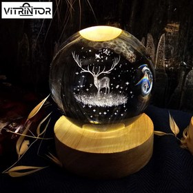 تصویر گوی کریستالی چراغدار طرح گوزن 8 سانتی ا Illuminated crystal ball with deer design, 8 cm Illuminated crystal ball with deer design, 8 cm