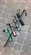 تصویر باتوم شن سوی چهار تیکه فولادی (اورجینال) با غلاف مشکی 