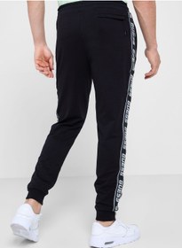 تصویر شلوار راحتی با چاپ کناری برند Guess Side Print Sweatpants