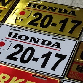 تصویر پلاک موتورسیکلت پاکشتی هوندا لوگو برجسته honda در دو رنگ طلایی و سفید پلاک موتور سیکلت پا کشتی گرینو دیو جوکر اسکوپی 