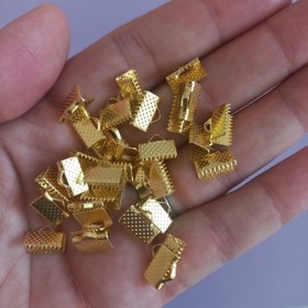 تصویر گاز گیر 10 میل (یک سانت)،طلایی ،بسته 10 گرمی،حدودا 30 عدد 