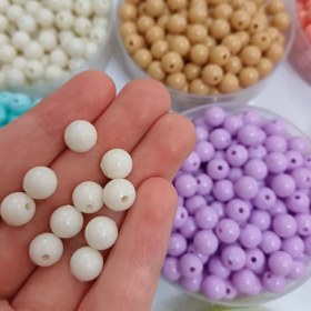 تصویر مهره رنگی ایرانی شیری سایز 8میل(100گرمی) 