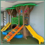 تصویر سرسره چوبی طرح درخت کودک 