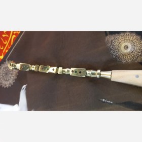 تصویر زنجیر دسته برنجی چوبی عزاداری محرم طلایی 