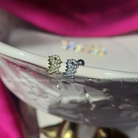 تصویر پیرسینگ دایناسور سفید 