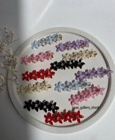 تصویر گیره‌ مو گل‌دار رزین سه‌تایی 