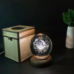 تصویر گوی کریستالی طرح ماه و فرشته 