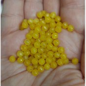 تصویر مهره سنگ جید زرد تراش جواهری سایز 4 سوراخ دار سنگ اصل طبیعی 