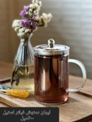 تصویر لیوان دمنوش پیرکس ۴۰۰ میلی‌لیتر با فیلتر استیل و درب فلزی 