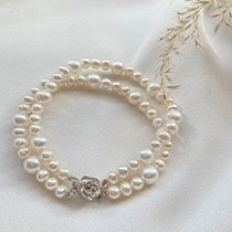 تصویر دستبند مروارید دو ردیف با قفل گل Pearl bracelet