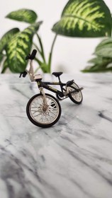 تصویر ماکت دوچرخه BMX فلزی مشکی و بنفش 