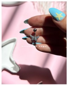 تصویر پیرسینگ واقعی ناف پروانه 