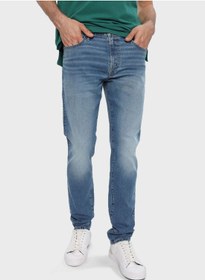 تصویر شلوار جین تنگ با رنگ شست‌وشو متوسط برند american eagle Mid Wash Skinny Fit Jeans