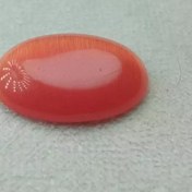 تصویر نگین چشم گربه قرمز بیضی شکل 