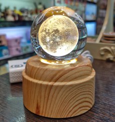 تصویر گوی موزیکال کریستالی گردان چراغدار 