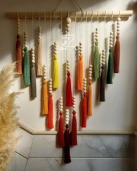 تصویر رنگین کمان نخ و مهره 