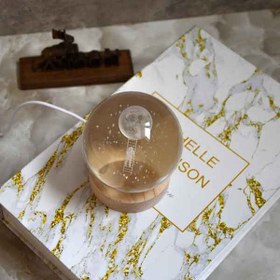 تصویر چراغ خواب گوی کریستال طرح فضانورد و ماه سایز ۱ 