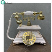 تصویر تلفن رومیزی سلطنتی میرون مدل 123، تلفن رومیزی سلطنتی با ترکیب رنگ سفید طلایی، دارای شناسه تماس گیرنده و شماره گیر دکمه ای 