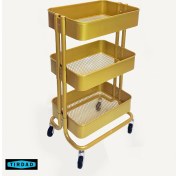 تصویر ترولی سه طبقه فلزی رنگ طلایی مدل چرخک 