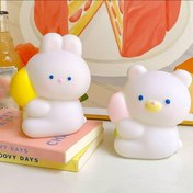 تصویر قلک فانتزی طرح خرگوش و خرس قلب به دست 