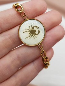 تصویر دستبند تولد تیرماهی 