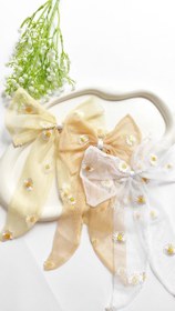 تصویر گیره مو زنانه طرح پاپیون و بابونه 