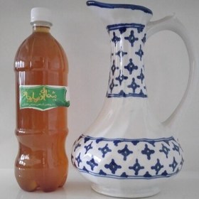 تصویر روغن رزماری نیم لیتری تهیه شده به صورت بنماری از خود گیاه فاقد هرگونه رنگ و اسانس 