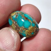 تصویر نگین فیروزه نیشابوری سبز آبی با رگه های طلایی 