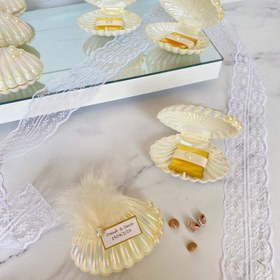 تصویر صدف مرواریدی یه هدیه‌ی رویایی از دل دریا، با طعم شکلات و برق مروارید