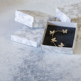 تصویر جعبه جواهرات 12 عددی بسته بندی شده مدل پایه کوتاه سنگی سفید 