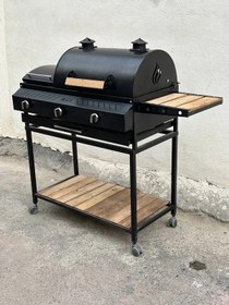 تصویر باربیکیو گازی ۹۰ سانتی پلوپز دار با رویه چدنی 