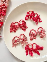 تصویر کش مو پاپیون طرح دار 