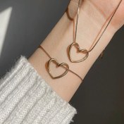 تصویر ست گردنبند و گوشواره قلب دفرمه رنگ نقره ای ضد حساسیت 